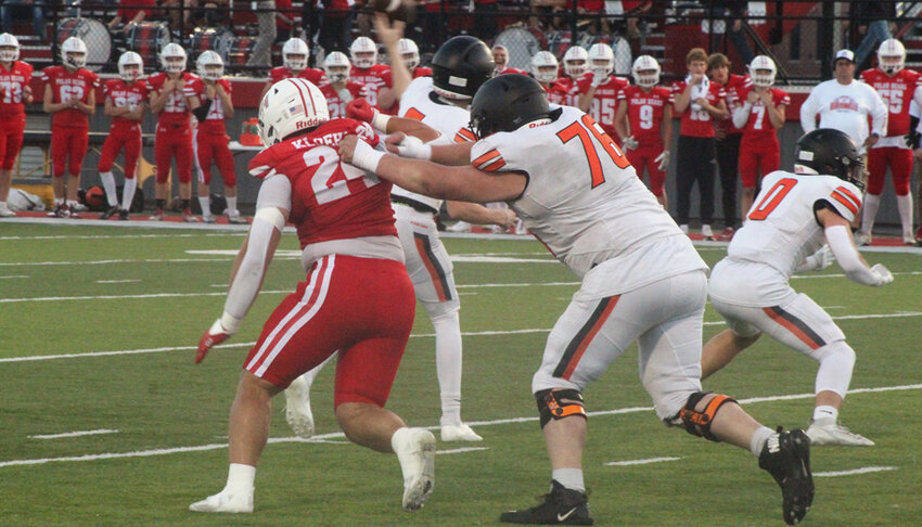 Hortonville Polar Bear defensive lineman and Idaho Vandals commit Reggie Kloehn beats his blocker around the edge.Nick Griesbach Photo