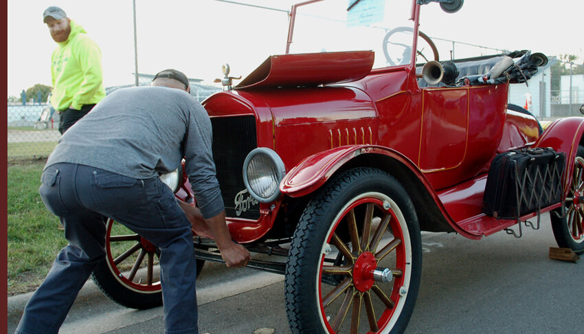 Mike Breyer of Hortonville turns over his 1923 Model-T Ford during a prior Wheels on Werner Allen Car Show. The event kicks off Fall Fest in New London..File Photo