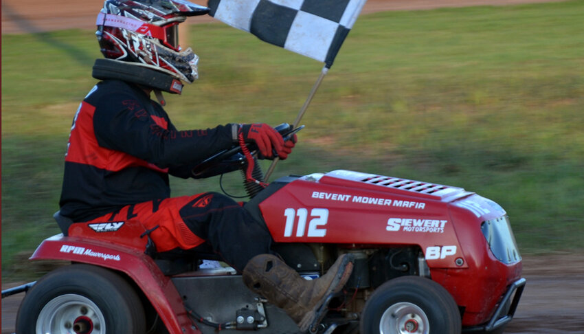 After a ten-lap heat, the winner of the race gets to take a victory lap with the checkered flag. .James Card Photo