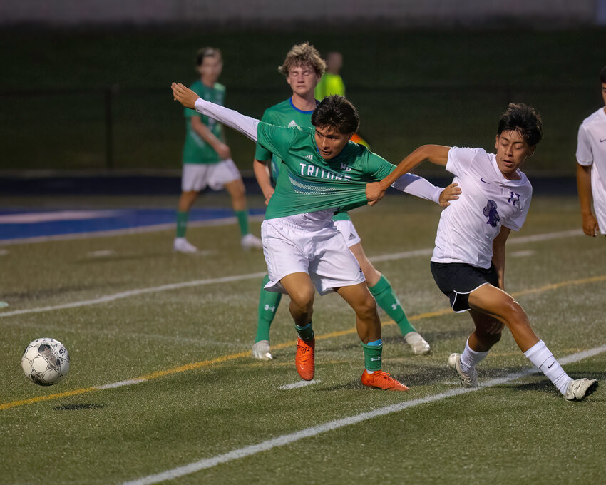 Beloit Memorial Defener #17 Brandon Luis-Aragon tried to hold back Notre Dame Forward #7 Sebastian Garcia from the ball.