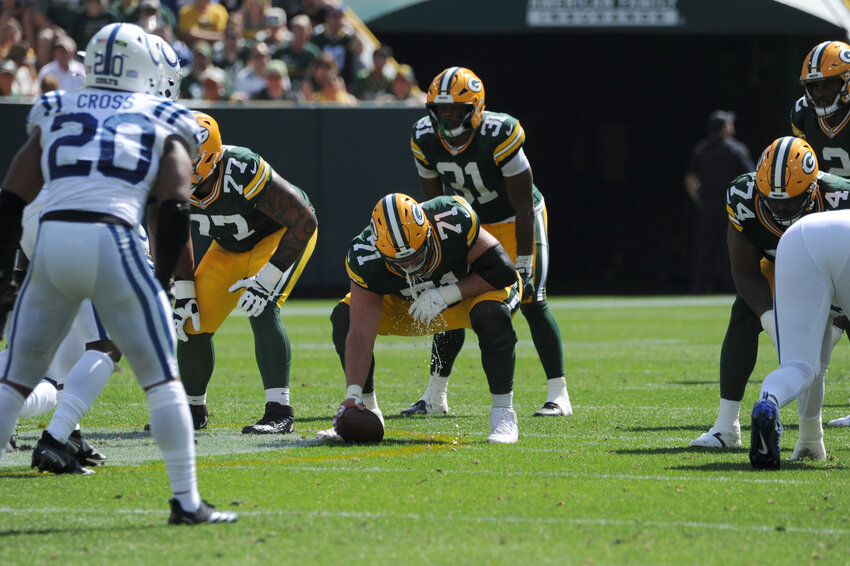 Green Bay Packers Center Josh Meyers leaves it all out on the field as he gets off a third and long snap to quarterback Malik Willis in their game against the Indianapolis Colts on Sunday, Sept. 15.