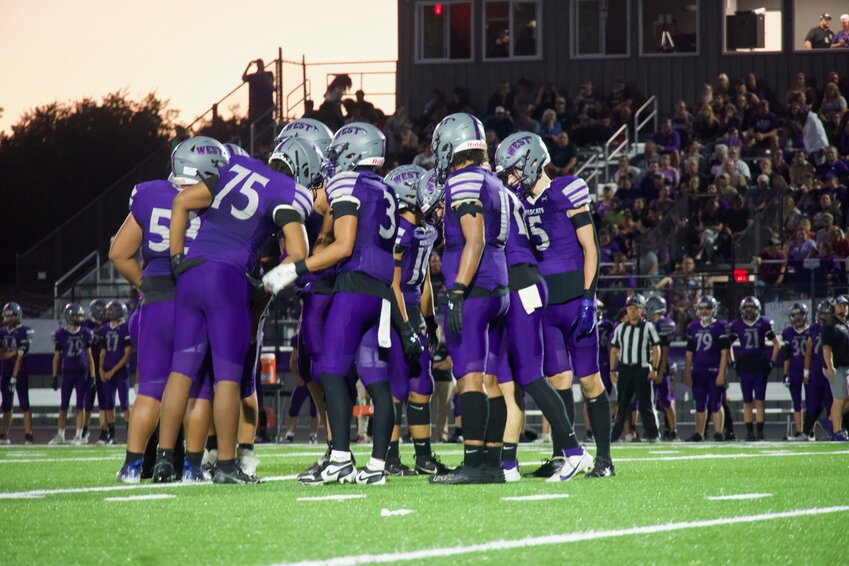 The Green Bay West Wildcats huddle to break down the next offensive possession.