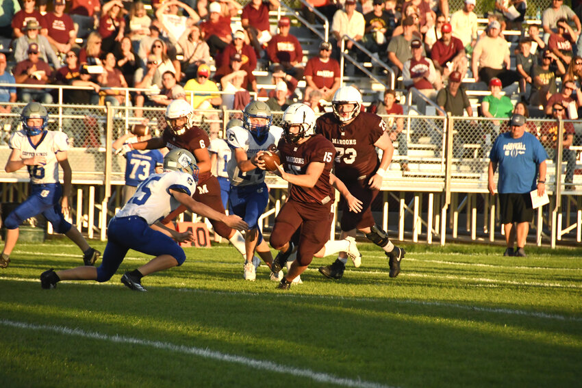 Maroon Tanner Theuerkauf releases a pass that found an open Kaiden Bell on a crossing route in the endzone.