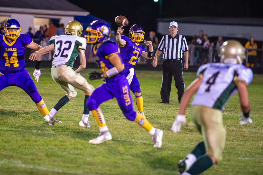 Eagles signal caller Michael Pecanas delivers a short pass to the flat on Friday night at home against Lena/STAA.