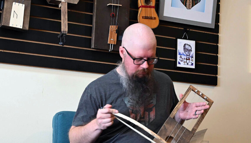 Eric Bestul plays one of the midieval instruments that he made..Emily Conroy Photo