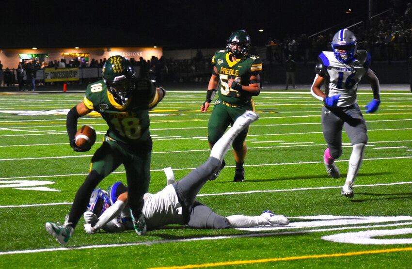 Green Bay Preble receiver Braylon Schadt scores a touchdown after breaking a tackle in the Hornets' 35-7 victory over Green Bay Southwest on Oct. 4