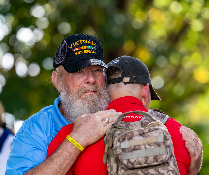 An emotional moment is shared on the National Mall during the Oct. 5 Stars and Stripes Honor Flight – Flight of Champions.