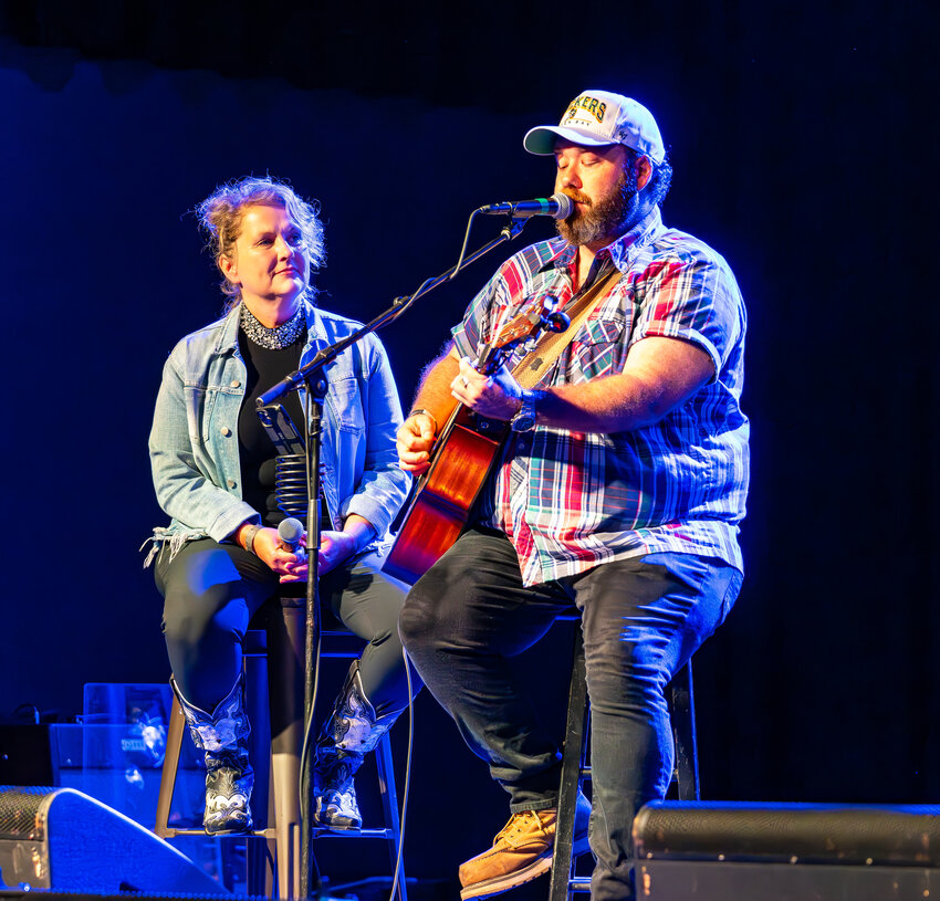 Kathy Treankler of Green Bay listens to the song she wrote with Menominee Falls native and Nashville songwriter Tayor Davis about her Vietnam Veteran father.