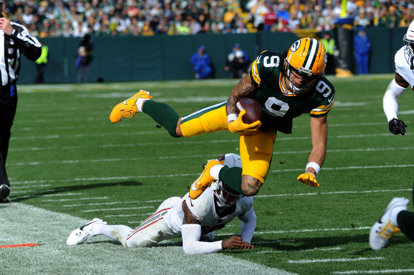 Green Bay Packers Wide Reciever Chrisitan Watson clinches a reception along the sideline.