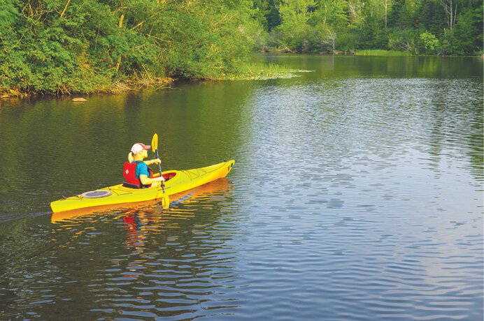 A paddler enjoys the solitude of the Pelican River Forest. This project preserved 70,000 acres of forest land across Langlade, Forest, and Oneida Counties.