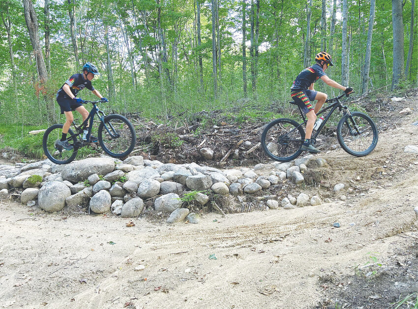 The NICA team perfects their rock skills on optional lines over Heal Creek's abundant boulders.