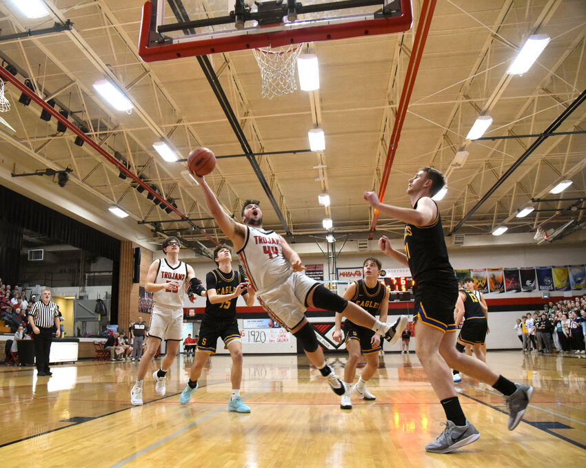 Trojans’ senior Kevin Giuliani #44 will go to any length, even horizontal to get a shot at the basket.