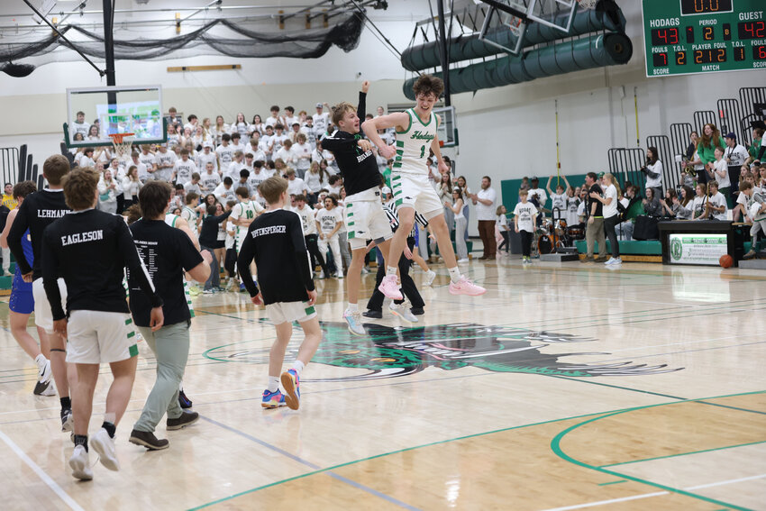 Jackson Weinzatl and Jatyn Barkus celebrate after Rice Lake's desperation 3 point shot hits the rim as time expires..