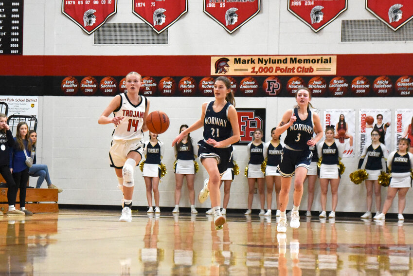 Lady Trojan junior, Elsie Williams #14 charged down the court for a shot at the basket.