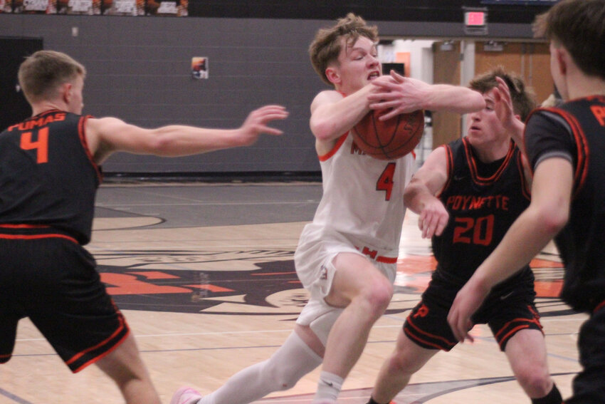 Reed Vorlob controls the ball at the top of the key.