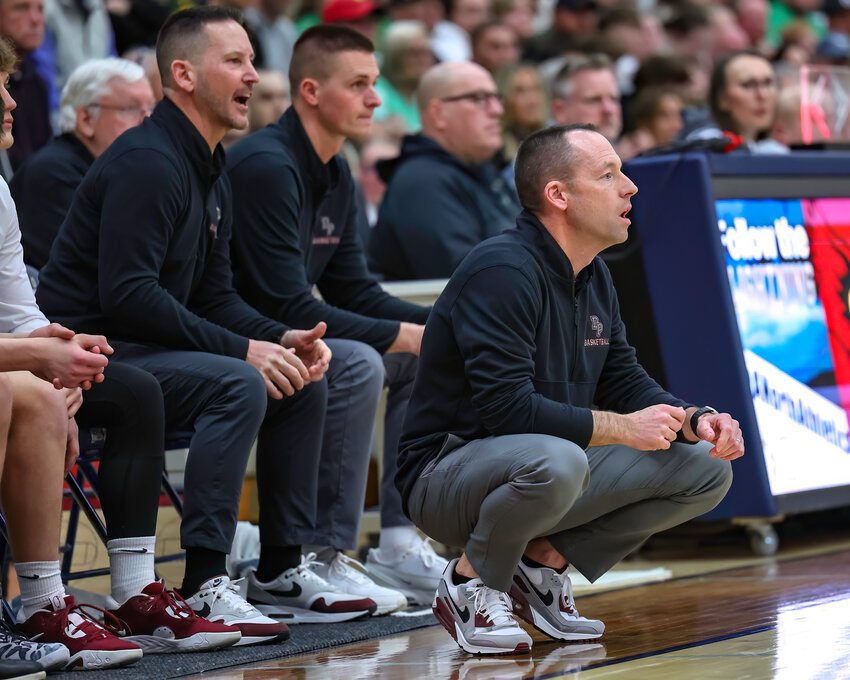 De Pere coaches Brian Winchester and Jeff Kinziger direct team action.