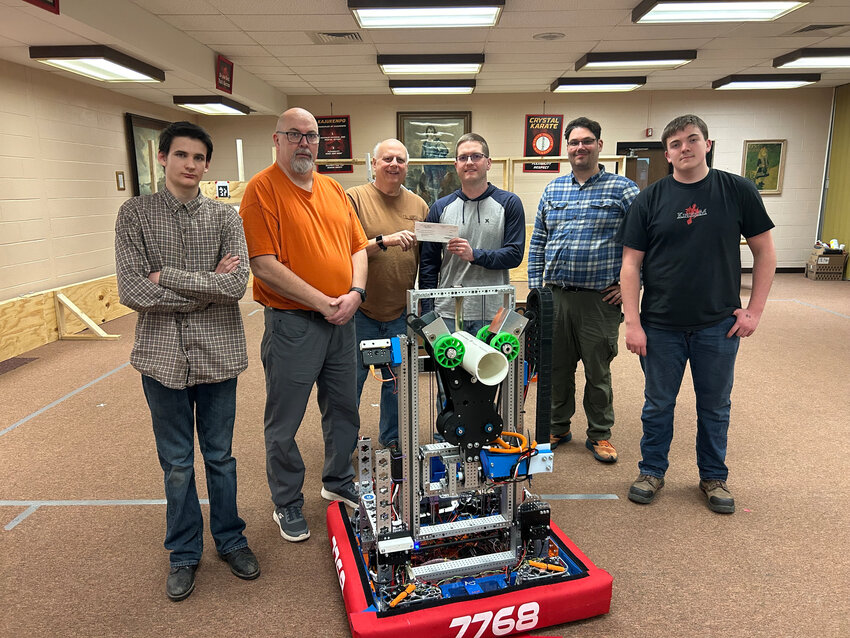 Pictured are, from left, Syler Joseph (AutoMaton Team Member), Van Hill (AutoMaton Team Coach), Ray Guzowski (Robotics Booster Club Treasurer), Dan Surface (Crystal Falls Area Community Foundation President), Jeff Davis (AutoMaton Team Assistant Coach) and Cooper Hill (AutoMaton Team Member).