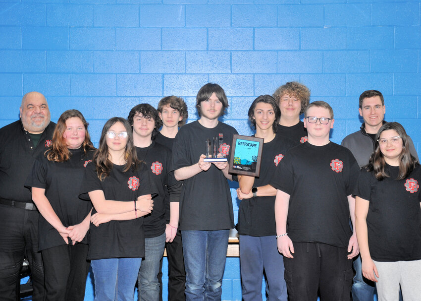Trojan Power Robotics team completed its first competition of the season in Escanaba March 9 and was awarded the prestigious Creativity Award sponsored by Rockwell Automation. This award recognizes and celebrates the technical accomplishments of teams in planning, designing, construction and operation of their robots and creativity that enhances the strategy of game play. Pictured are, from left, Jim Friend (Advisor), Kya Bohto, Ally Harper, Chase Frailing, Morries Holm, Jacob Bricker, Will Hoffman, Connor LaPlant, Kevin Brunswick, Will Toivonen (Advisor) and Eliza Curtis.