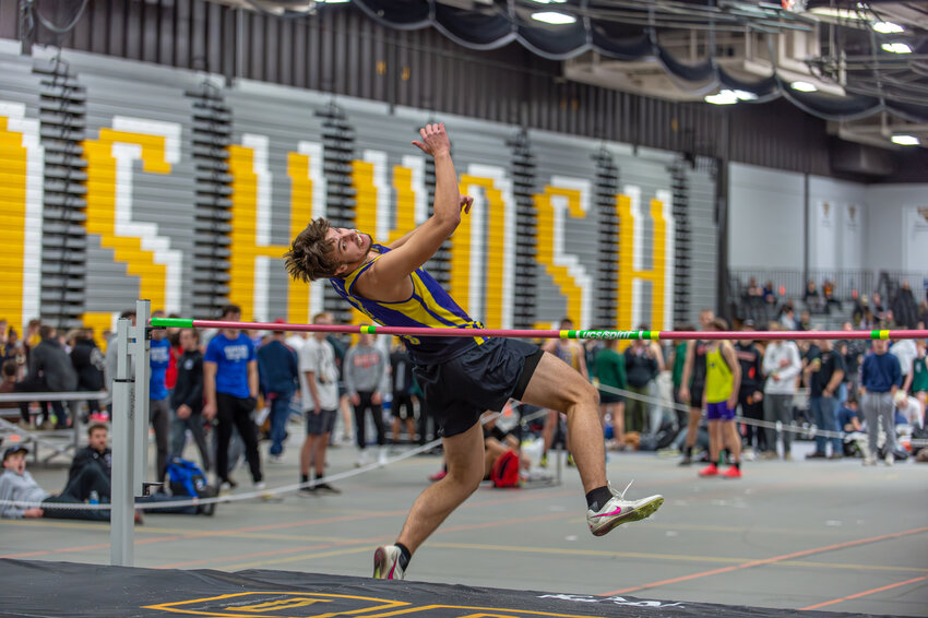Suring’s Dayne Ermis easily clears a preliminary height on Thursday in Oshkosh on his way to a 3rd place finish in the Division 3 high jump event.