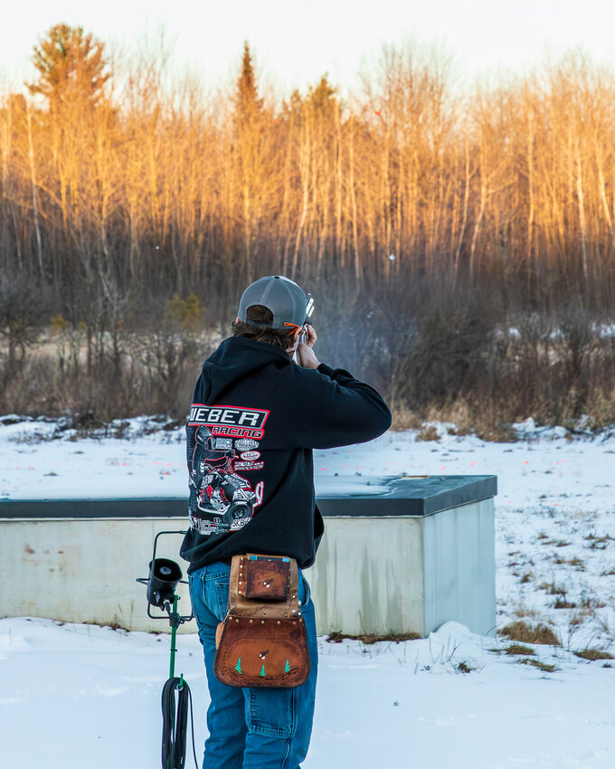 High school Junior Chris Holz takes his turn at shooting.