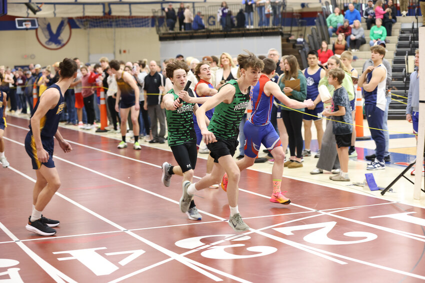 Grady DeBay handx the baton to Kamden Kostrova as the Hodags race in the 4x200 event. Other team members were Paul Denis and Sebastian Lieder-St. Peter.