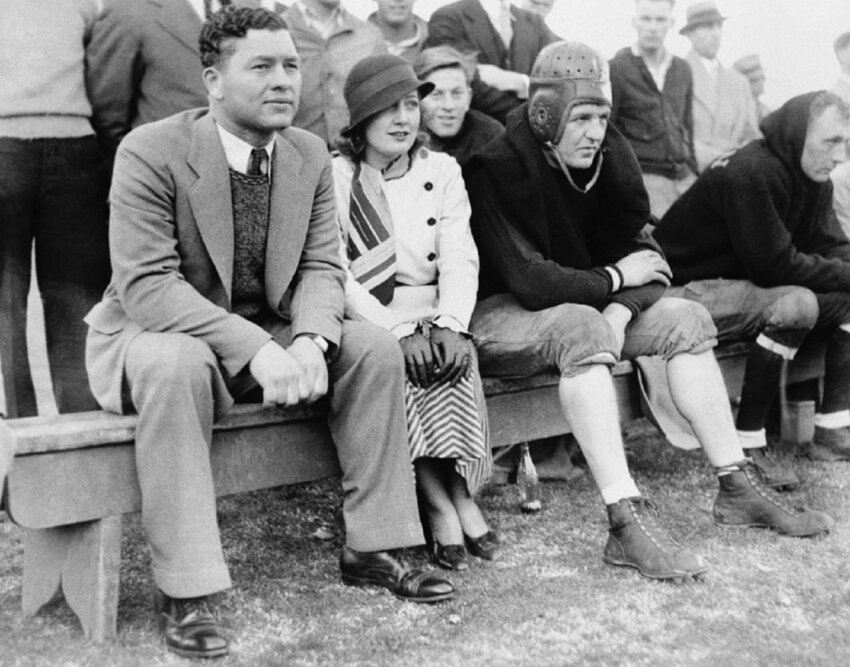 Packers Head Coach Curly Lambeau, actress Myrna Kennedy and Chicago Bears’ Red Grange attend an All Star game in 1933.