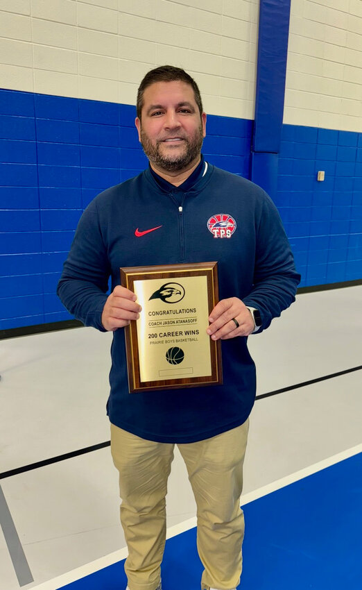Jason Atanasoff with his award for 200 wins.