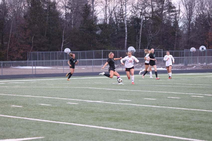 Ella Miljevich takes a shot against Stevens Point Thursday, April 10, scoring a goal.