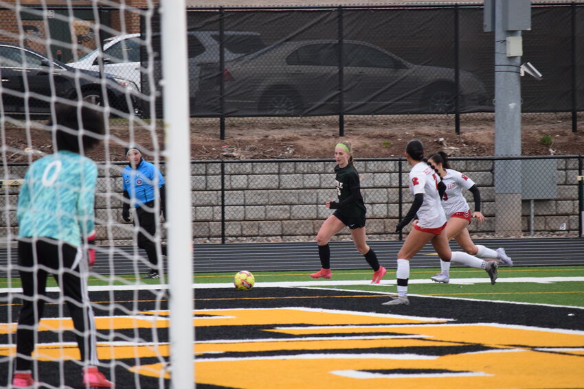 Preble's Samantha Thomson surges in front of the Green Bay East defense during their matchup on Tuesday, April 15.