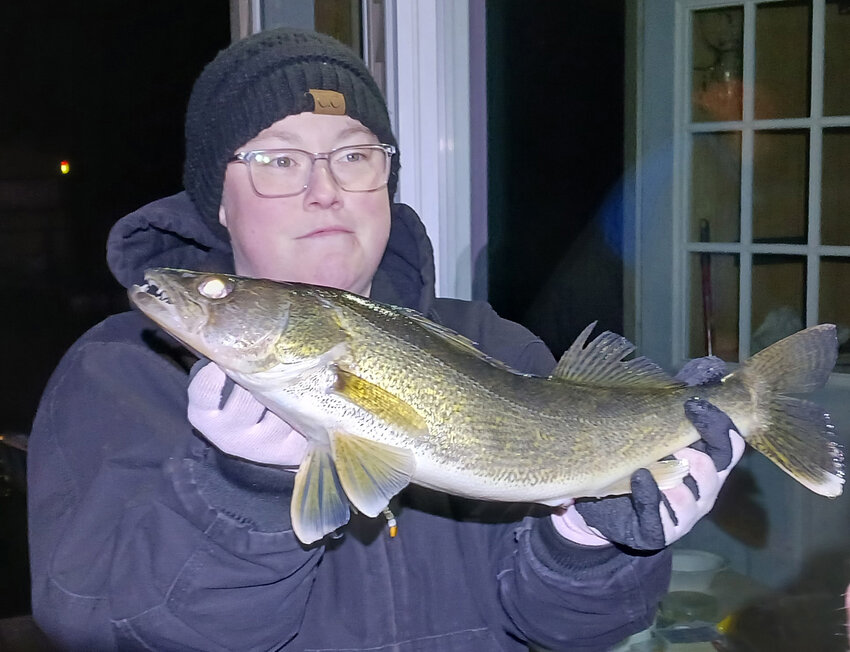 Krystal Hoffman of Waupaca holds up her first “back run” (post spawn) walleye caught on a cane pole while fishing the Wolf River near New London. Whopper Weekend anglers are hoping for hungry walleyes heading down river this weekend.
John Faucher photo.