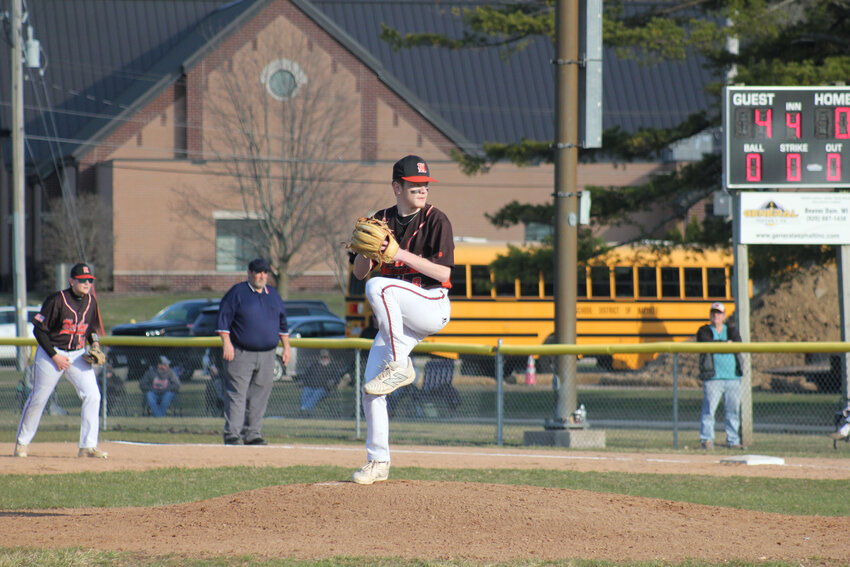 Owen Muche (#7) throws over to Cole Berggren (#14) to try and get an out at second base.