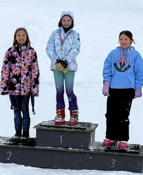 This year was the 30th Great Eight Winter Games, which were held in February. Pictured are from the ski race, Stella Schober of Forest Park, fifth grader, won first place. Mora Anderson of Forest Park, fifth grader, came in second and Lydia Sparapani of  Kingsford, fifth grader, took third.