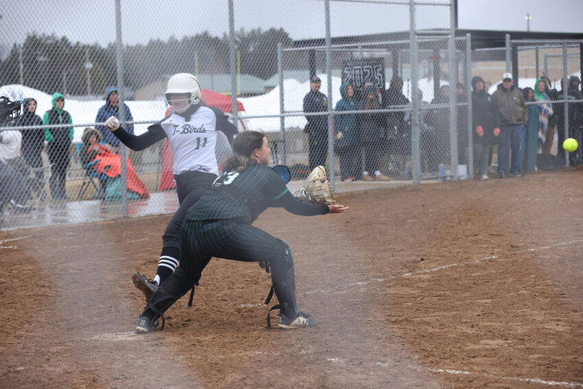 Freshman Saige Mutter waits for the throw at home to get the force out as the bases were loaded. The ball arrived in time to record the out.