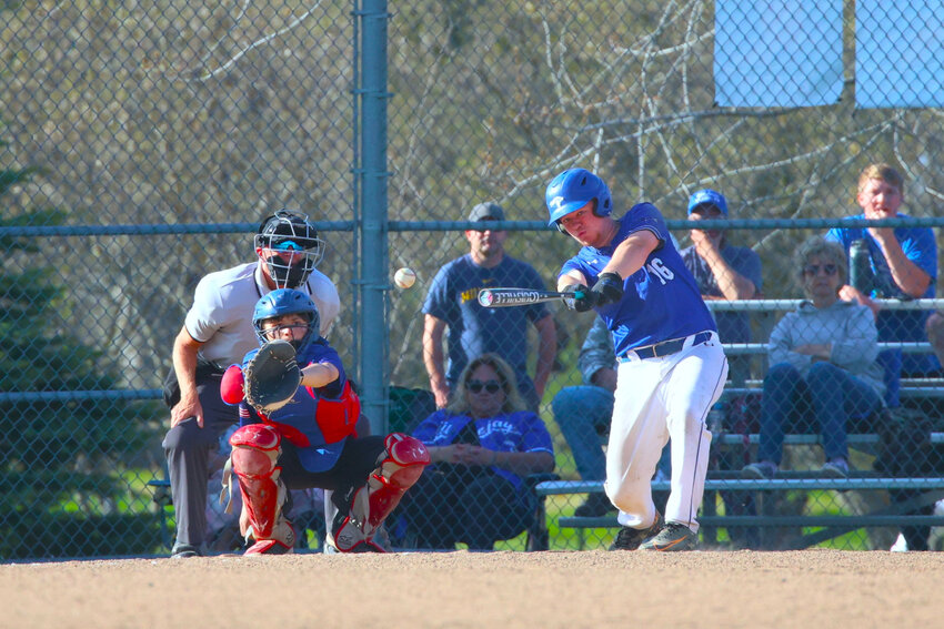 Shortstop Carter Flannery looks high in the sky to field an infield popup last week in a Northern Lakes Conference game.
