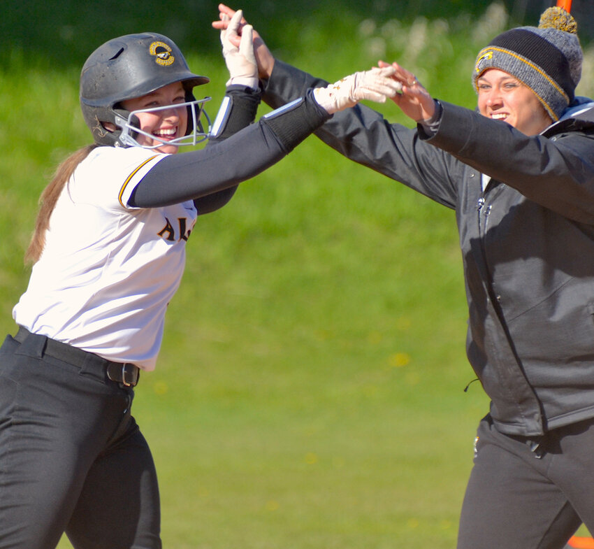 Algoma senior Nora Krause had four hits in a thrilling 11-9, 10-inning win over Sevastopol at Institute Tuesday. The Wolves finished Packerland Conference play unbeaten at 8-0, and are 12-5 overall heading into a non-conference game against Valders at Peterson Park May 16. Krause is shown with assistant coach Lindsay Harmann after a hit in a win over visiting NEW Lutheran last week.