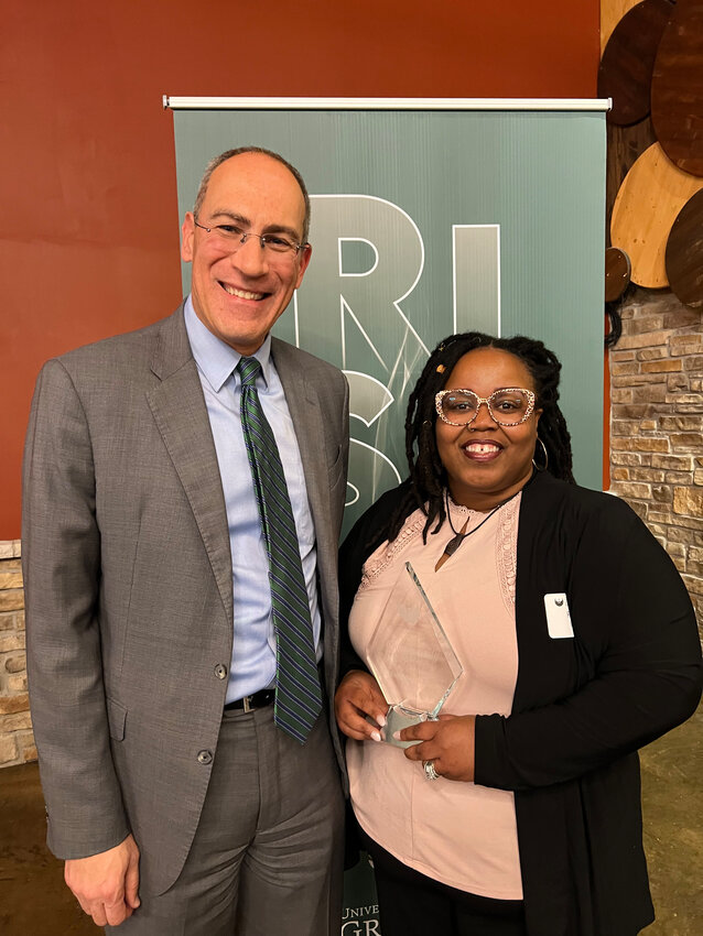 During the UW-Green Bay spring council of trustees reception and dinner, Robin Nicole Scott, executive director of We All Rise: African American Resource Center was presented with the Community Service Award. Scott, right, is pictured with UW-Green Bay Chancellor Michael Alexander.