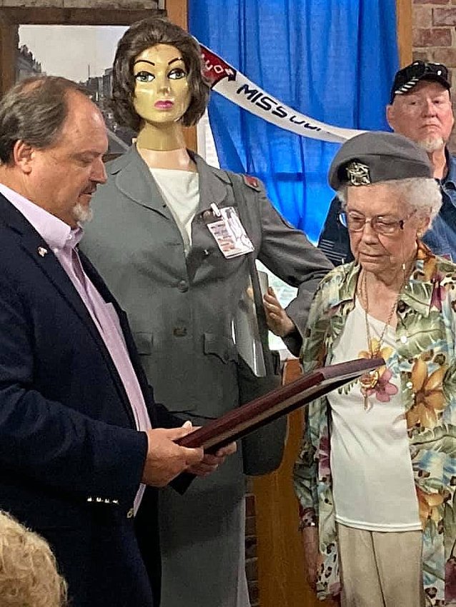 As part of Governor Mike Parson's Bicentennial Tour to some rural communities recently he visited Macon and Marceline. Missouri 6th District State Rep. Ed Lewis was also present at each site, and while in Macon Rep. Lewis presented a House Resolution to a WW II nurse cadet named Edith Harrington, 98.  She cared for wounded soldiers in Topeka in 1943-1944. The governor gave Harrington a challenge medal.