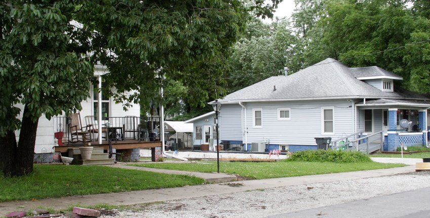 This street scene between the residences at  313 E. Burkhart, left, and 319 E. Burkhart, right, on the night of July 8 is where Mitchell Duane Nickerson was found by Moberly police officers lying in the street with a gun shot wound to his head. Jerry Fitzwater was arrested at his home at 319 E. Burkhart and is accused of shooting the victim, who died over the weekend.