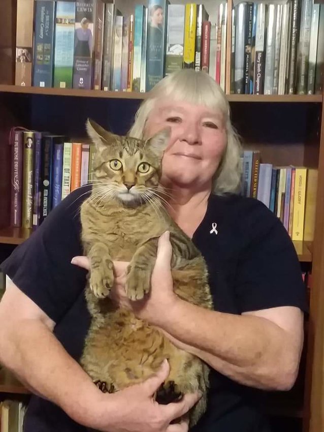 Shirley Ann Hess Friedly holds her cat Muffin, the subject of a children's book named &ldquo;Mommy and Me: The Adventures of a Cat Named Muffin&rdquo; she has written and recently published.
