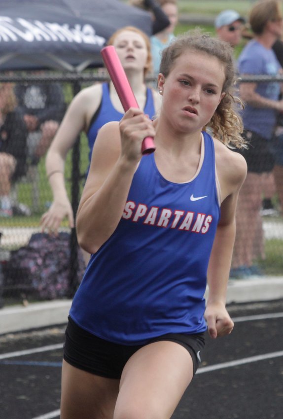 Ashton Martin is shown with the baton and is a member of the Moberly varsity girls 400m relay team that finished third at the 2021 North Central Missouri Conference Track &amp;amp; Field Championship Meet held May 7 in Hannibal. Other relay members are sisters Isabella and Chloe Ross and Arianna Wilkey and their time Friday was 4:27.57.
