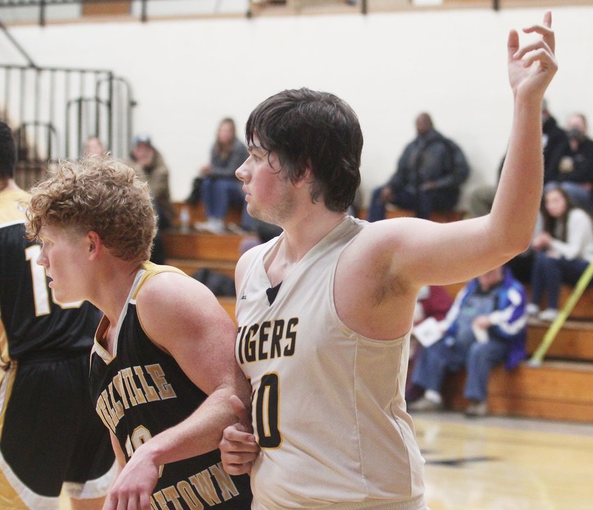 Higbee junior Jamie Smith (#40) raises his left arm looking to receive the basketball near the right block during a home basketball game played earlier this season. Smith contributed three points Tuesday to help the Tigers defeat Northwest-Hughesville 62-50 in Class 1 state sectional action.