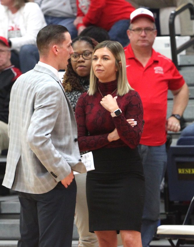 Moberly Area Community College head women's coach Hana Haden consults with her assistant coaches, Dustyn Yung and Jalisa Mitchell (center) during a time out of the 2020 NJCAA Region 16 women's tournament championship game won by the Lady Greyhounds. Standing in the background is longtime Moberly Greyhounds Booster Club member Jim Harms at the venue held last March at Lincoln University in Jefferson City.
