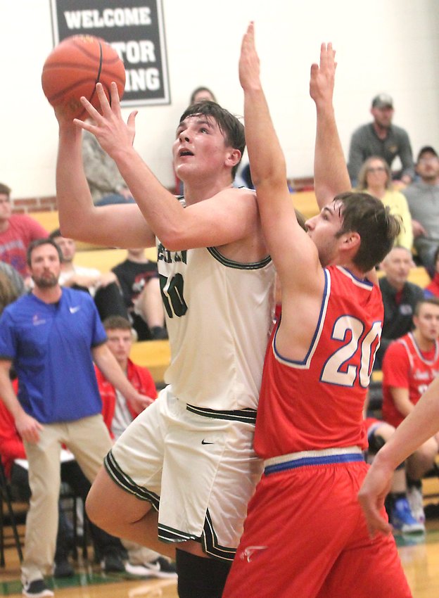 Westran 6'5 sophomore Langden Kitchen looks to score from the right block Tuesday while being guarded by South Shelby's Evan Smith. Kitchen scored a career-high 30 points to lift the Hornets to a 64-44 home victory in the 2020-21 basketball season opener for both schools.