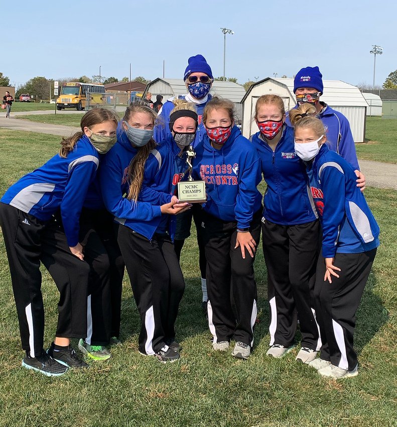 Moberly varsity girls cross country team won the 2020 North Central Missouri XC meet championship held Oct. 17 in Fulton. Lady Spartan runners are freshman Chloe Ross, seniors Isabella Ross and Maggie Crist, Malana Pence, junior AriAnna Wilkey and sophomore Anna Rivera. Also shown are head coach Greg Carroll and assistant coach Brian Hunsaker.