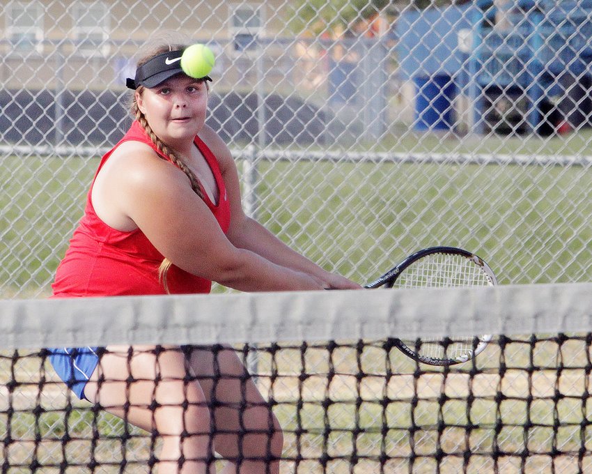 Senior Kristyn Kruse, Moberly's No. 1 singles player as well as the top doubles duo with Lilly Tagai, concentrates on returning a back hand stroke during her doubles match.  Kruse and Tagai dropped a 2-10 decision to Mexico's Shelby Kennemore and Lilly Yager, and the Lady Spartans team lost its dual match to the Bulldogs by a 1-8 result.