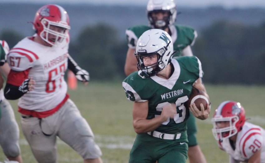 Westran Hornets senior running back Quinn Massey looks to his right as finds a seam to run through Friday for a 17-yard gain in the second quarter. Massey rushed for 135 yards, but Westran fell 44-14 at home to Harrisburg.