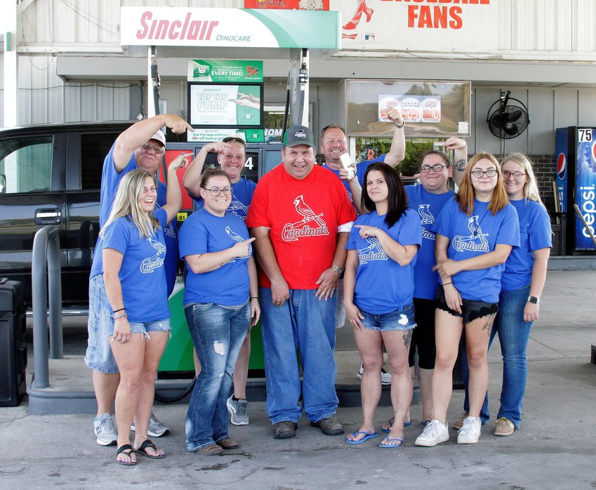 Dino Mart &amp;amp; Dinowash of Moberly owner Rob Gillenwater and his employees held a surprise celebration on Sept. 10, 2021 in honor of Kevin Embree for his 35 years of service at this same gasoline convenience store location at 1634 State Hwy JJ. Embree arguably may hold a world record for being a full service gas attendant at the same business for more than three decades. Many of his customers were told in advance to stop by for a visit and receive a free hot dog lunch between 10 a.m. and 2 p.m. that Friday. Dino Mart employees shown are (first row) Keri Benner, Amanda Gunn, Kevin Embree (red shirt), Jerri Oliver and Lillie Harville. (Second row) Van Benner, Jess Spotts, Dino Mart owner Rob Gillenwater, Nickie Little and Erin Little.
