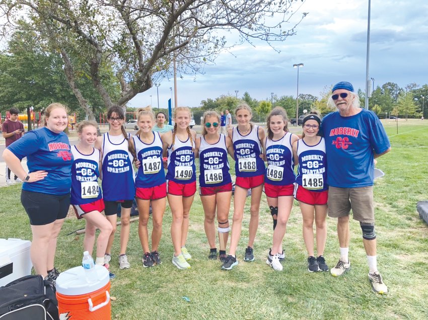 Pictured above are members of the Moberly girls cross country team that took first place at last week&rsquo;s home meet. Pictured, from left, are Coach Brandi Colbert, Kadence Blair, Lily Barker, Anna Rivera, Arianna Wilkey, Marlana Pence, Chloe Ross, Faith Snodgrass, Whitney Fenton, Coach Greg Carroll. (Submitted photo)