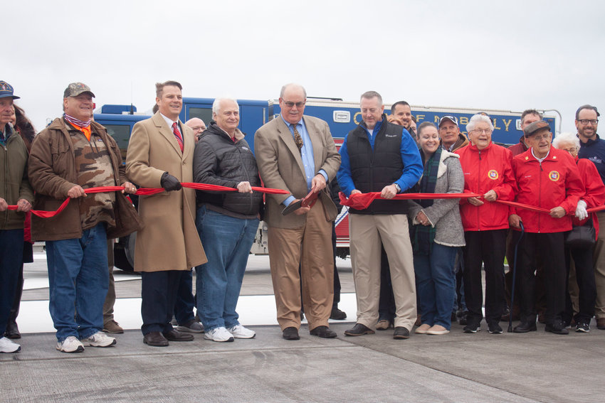 The ribbon is cut on the new, improved runway at the Omar N. Bradley Airport in Moberly on Oct. 29.