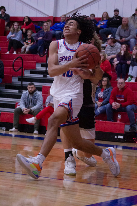 Moberly&rsquo;s Jaisten Payne takes the ball to the hoop in Tuesday&rsquo;s 50-49 loss to Centralia. Payne finished with a game-high 22 points. (Michael Allshouse)